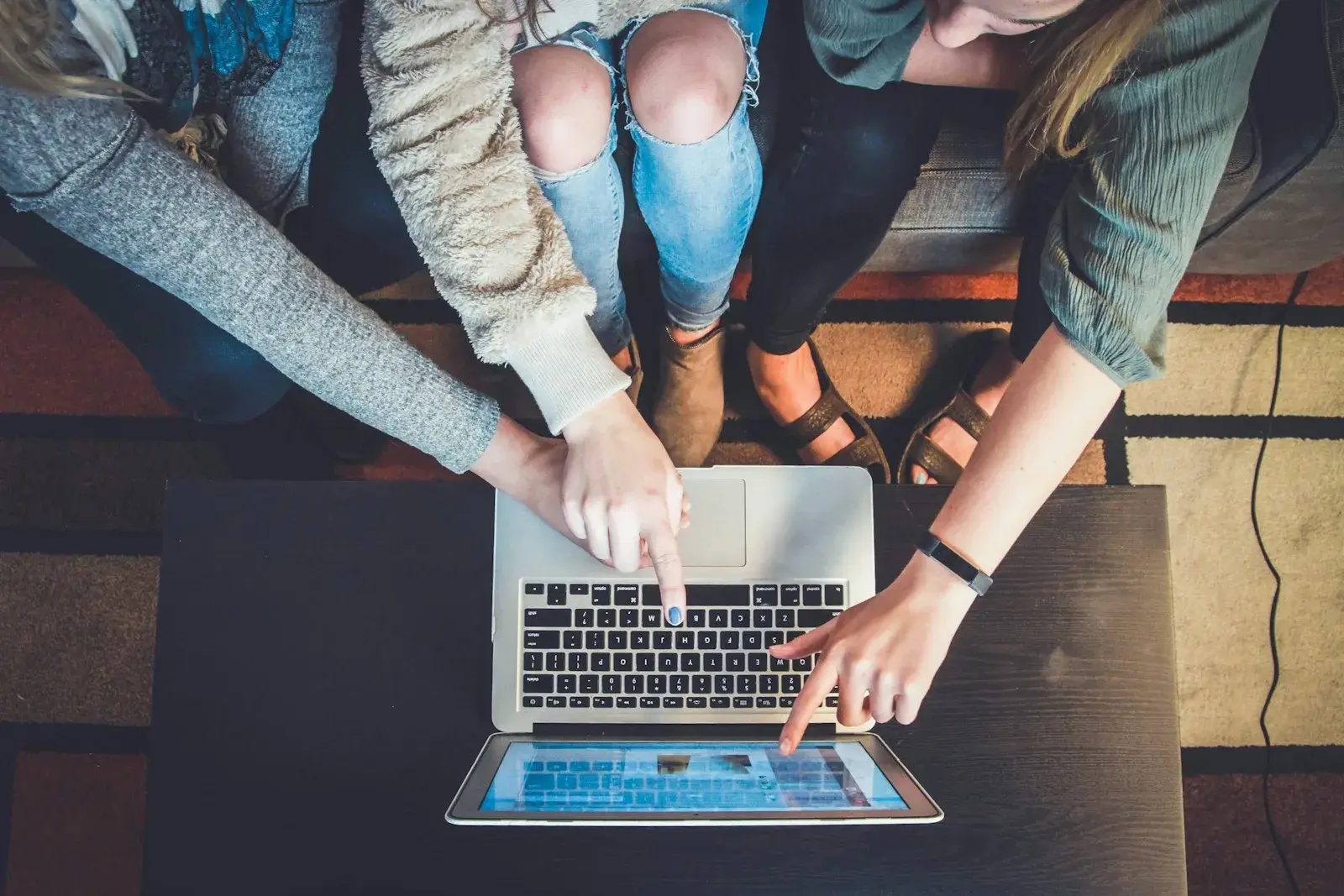 Team reviewing a website on a laptop